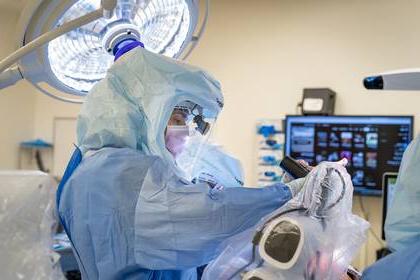 Surgeon Wayne Moschetti using a new robotic-assisted surgical tool.